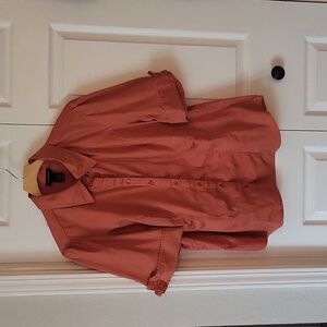 Light pumpkin color, button front top